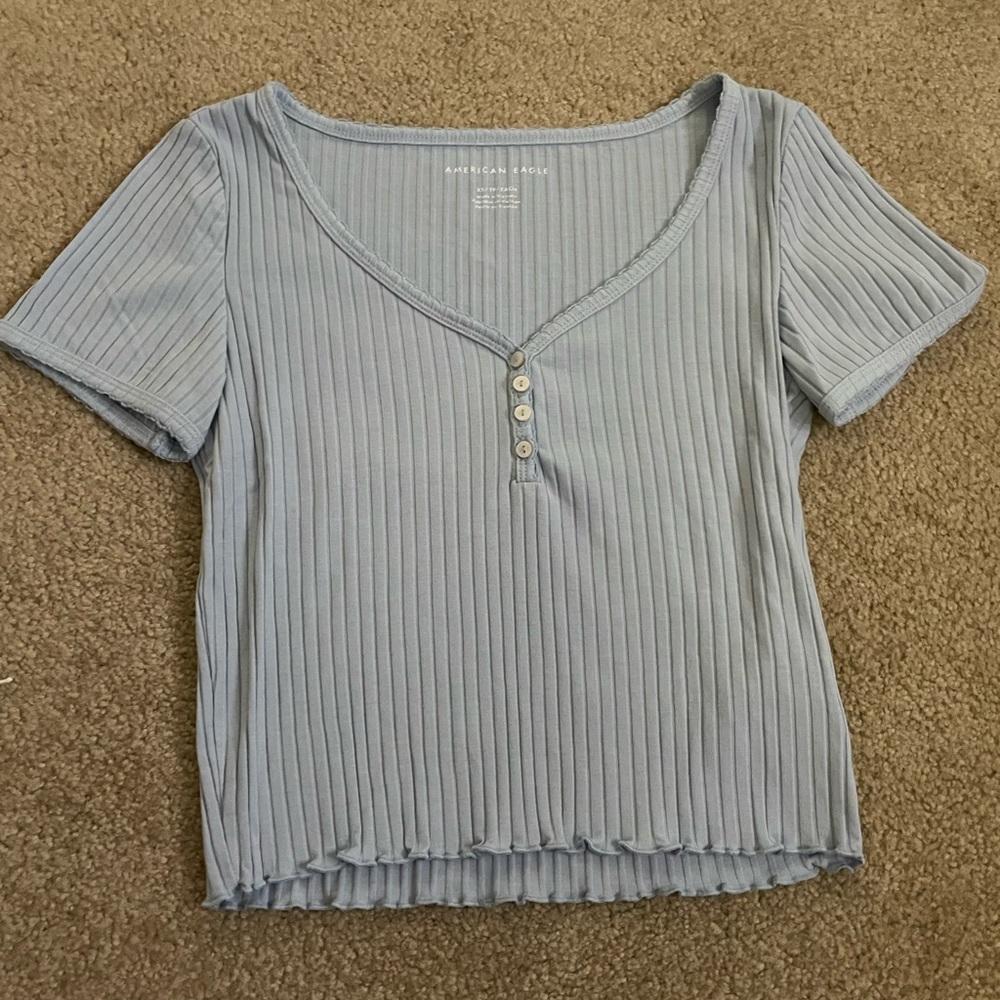 Light blue American Eagle crop top with three buttons.